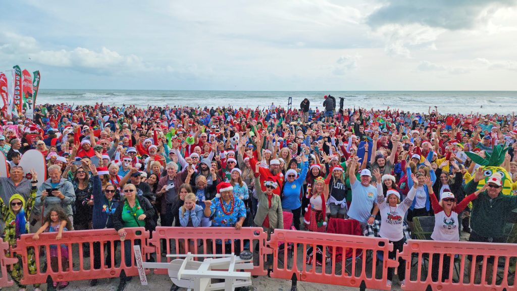 Surfing Santas crowd